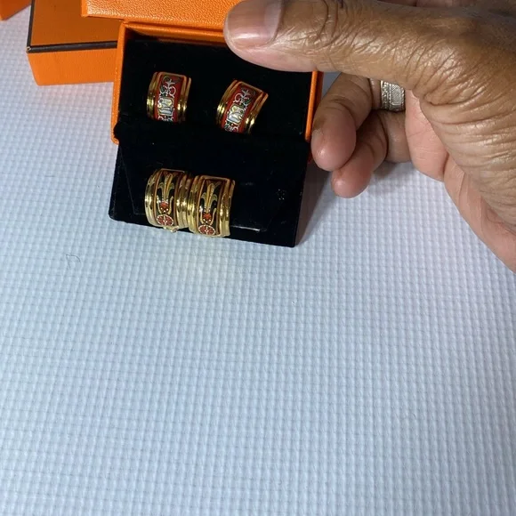 Hermes clip on earrings one blue and one red chose one